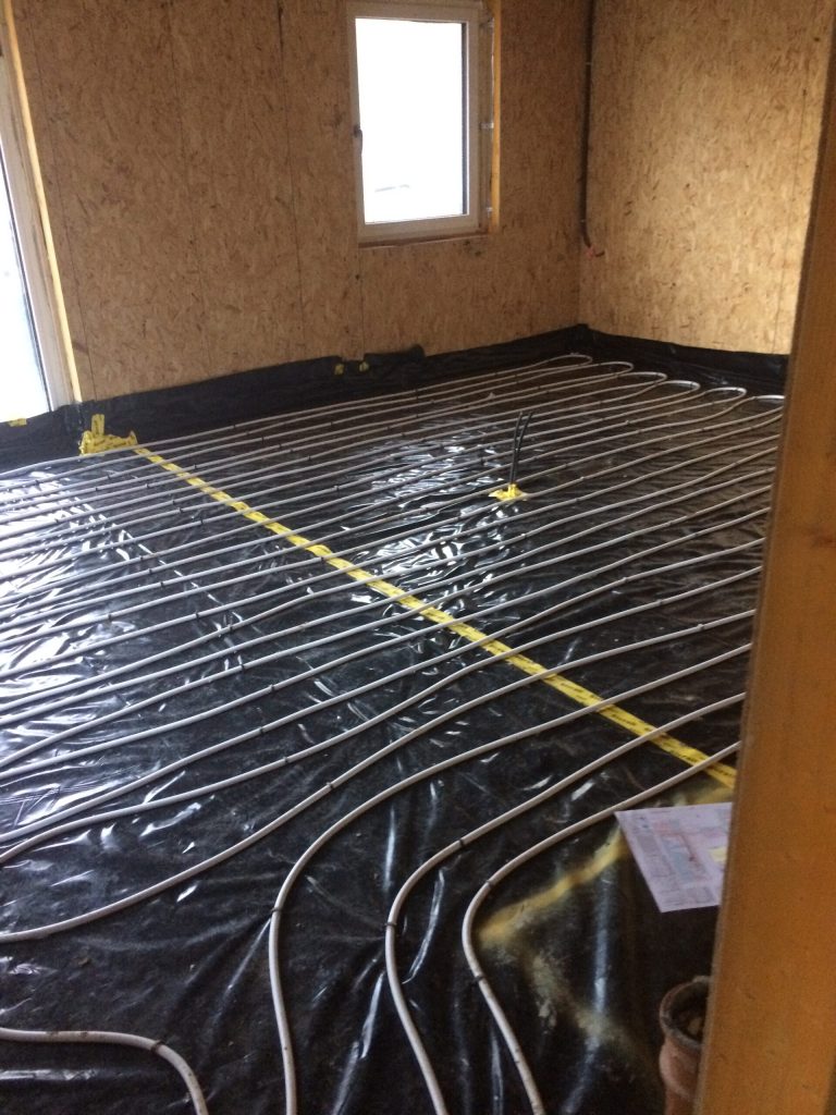 Underfloor heating pipes laid before the screed