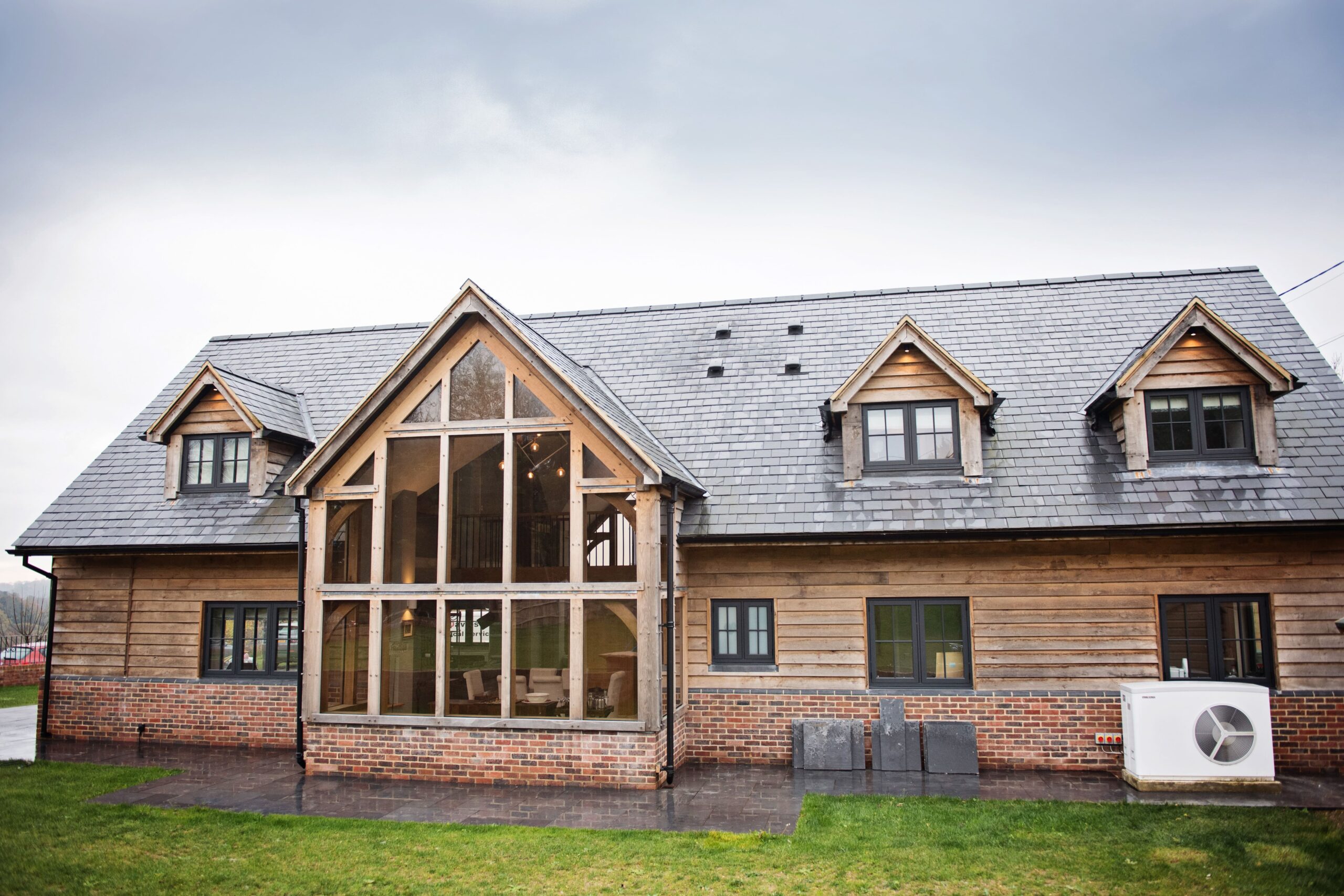 Timber-clad house with a large glazed gable