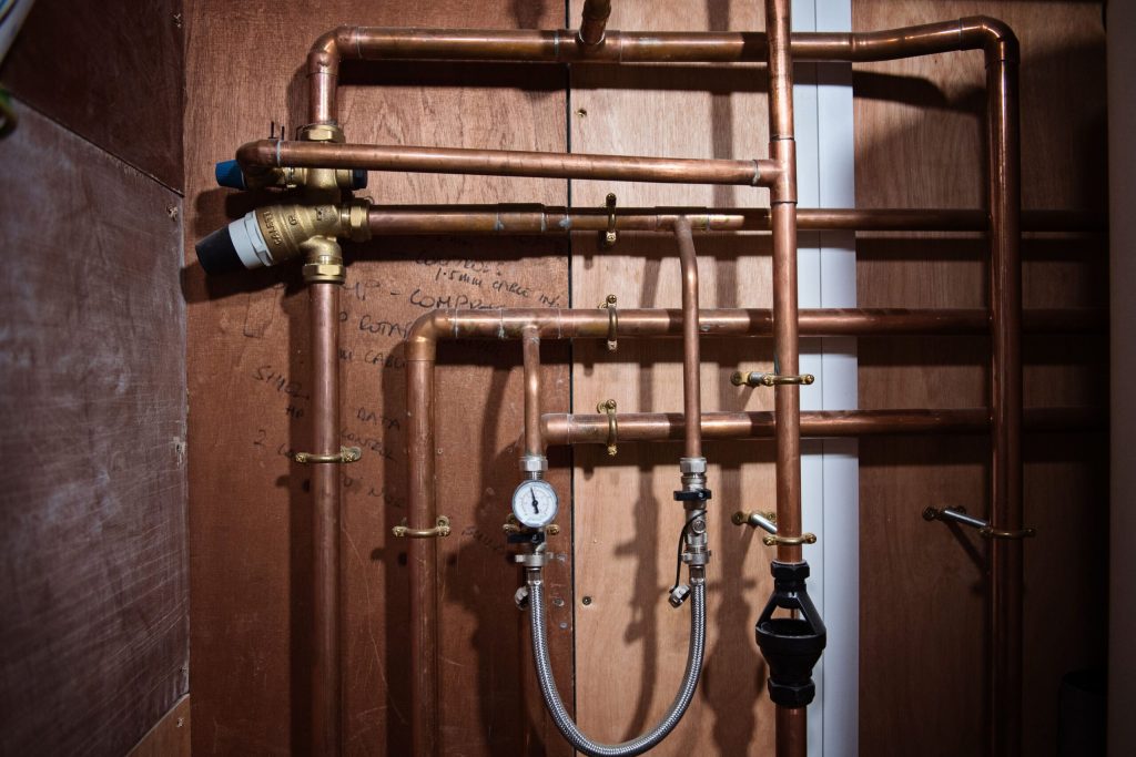 Insulated copper pipework and valves in a plant room