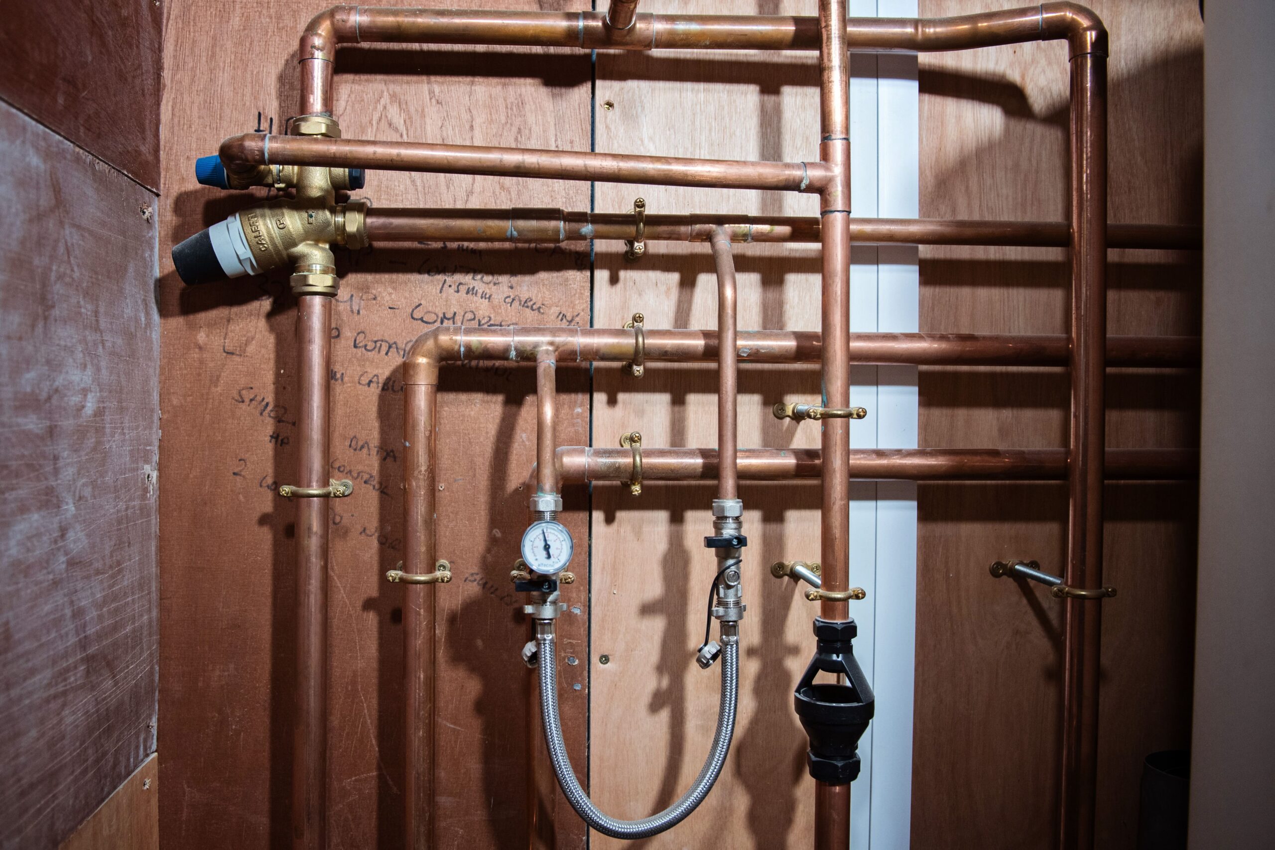 Insulated copper pipework and valves in a plant room