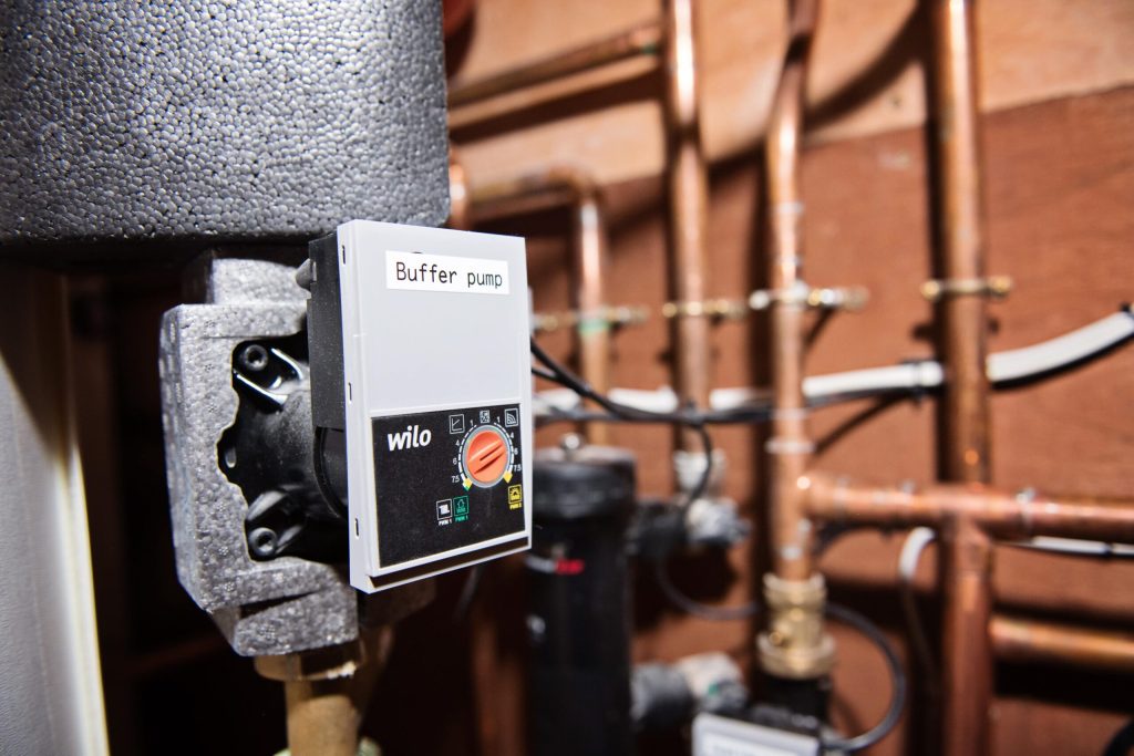 Close-up of a circulation pump on heating pipework