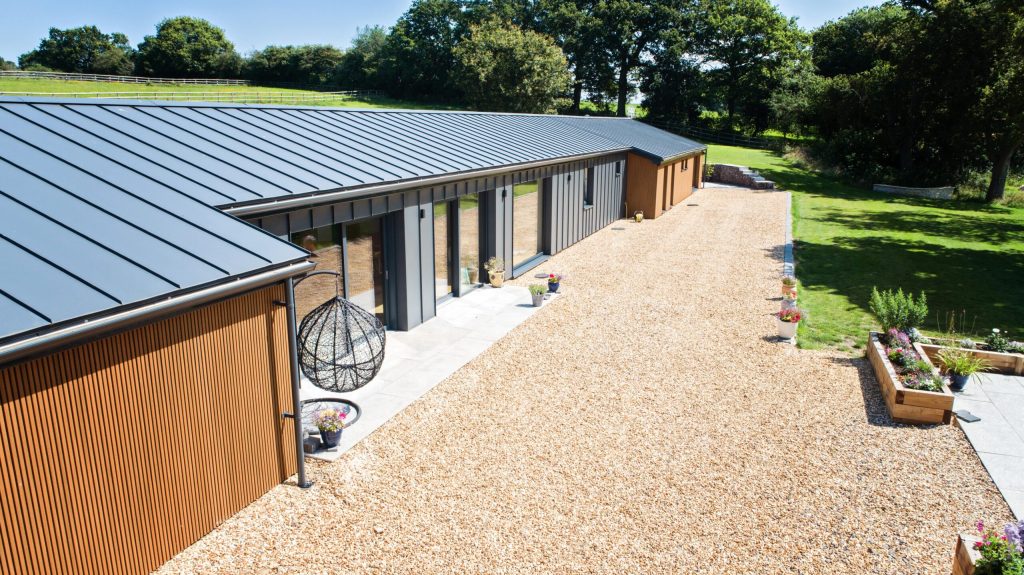 Single-storey timber-clad building with a metal roof