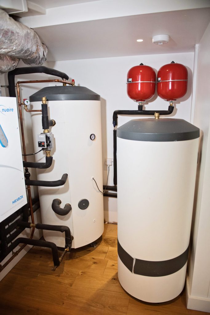 Hot water cylinders and expansion vessels in a plant room