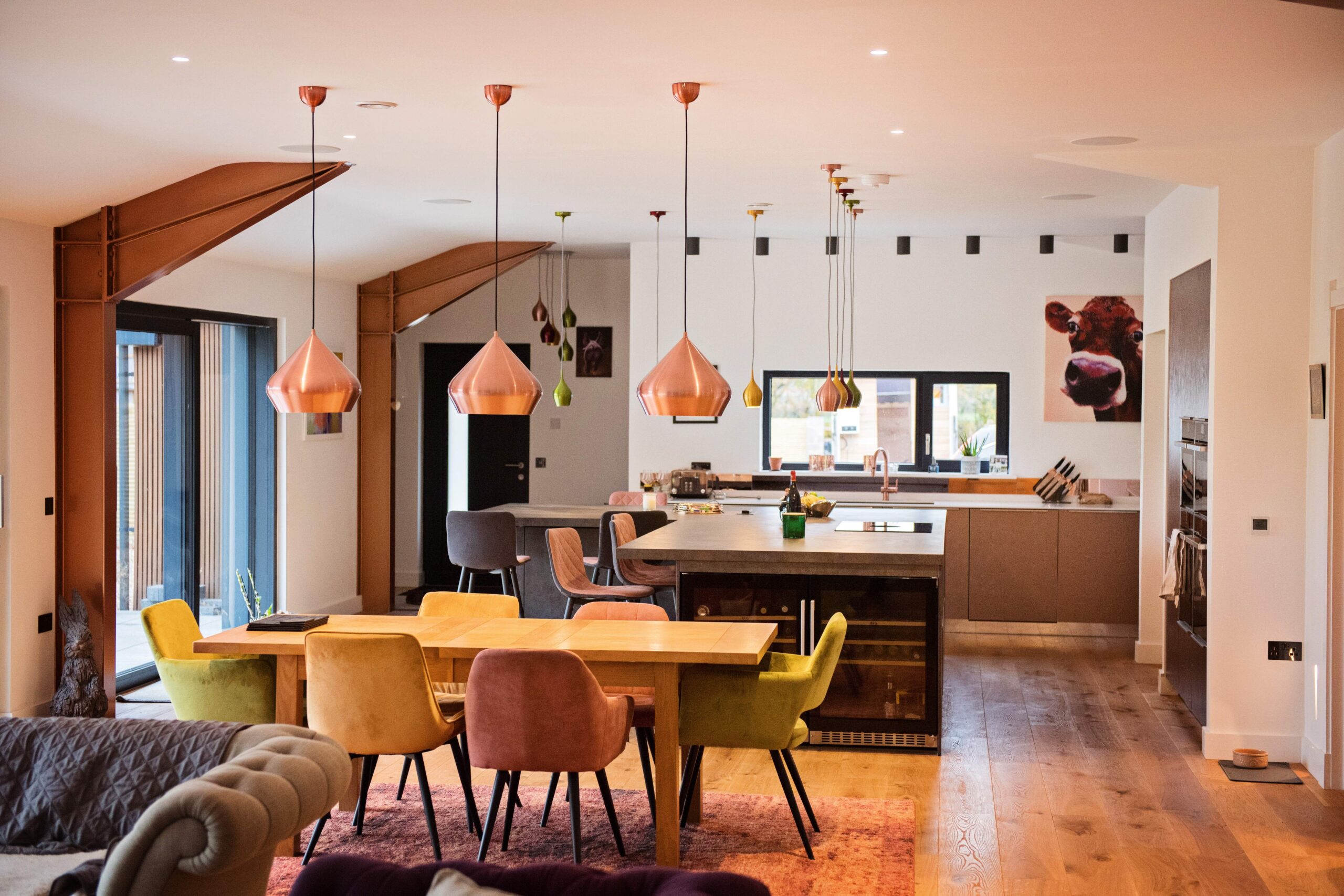 Open-plan kitchen and dining area with pendant lights
