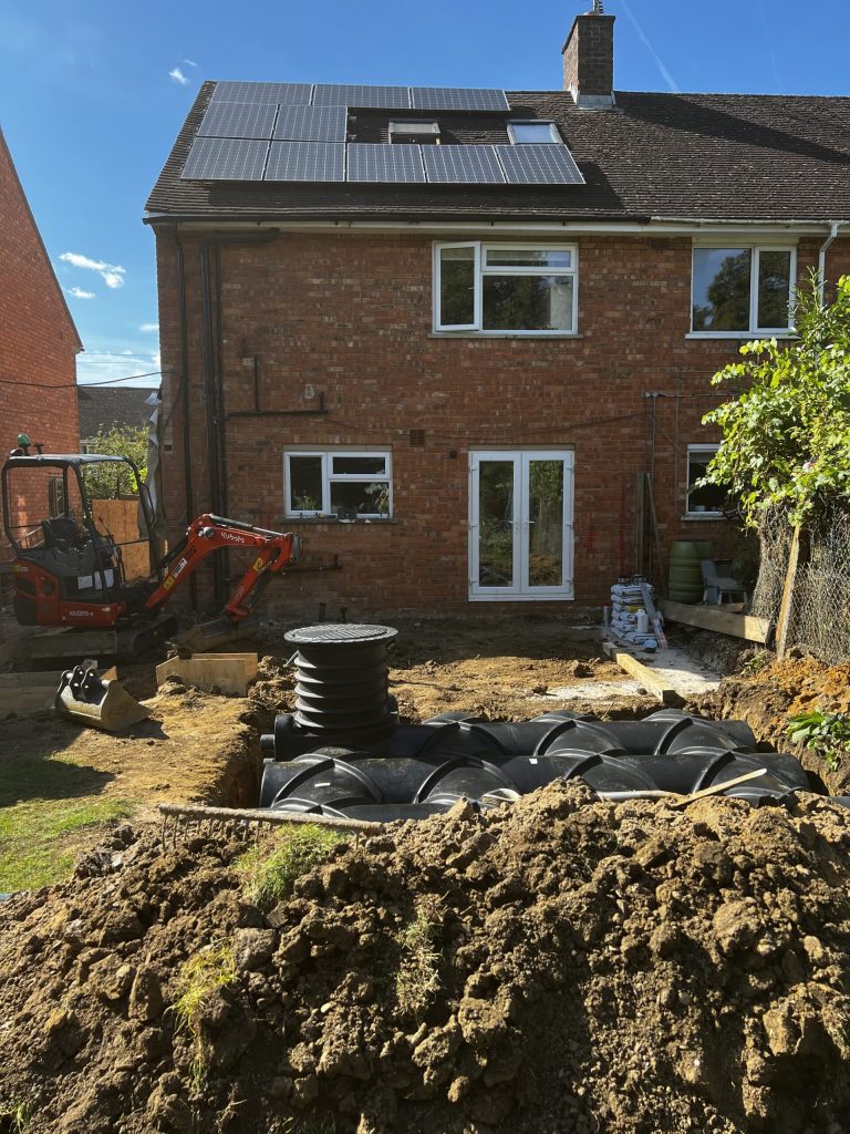Rear of a brick house with a garden