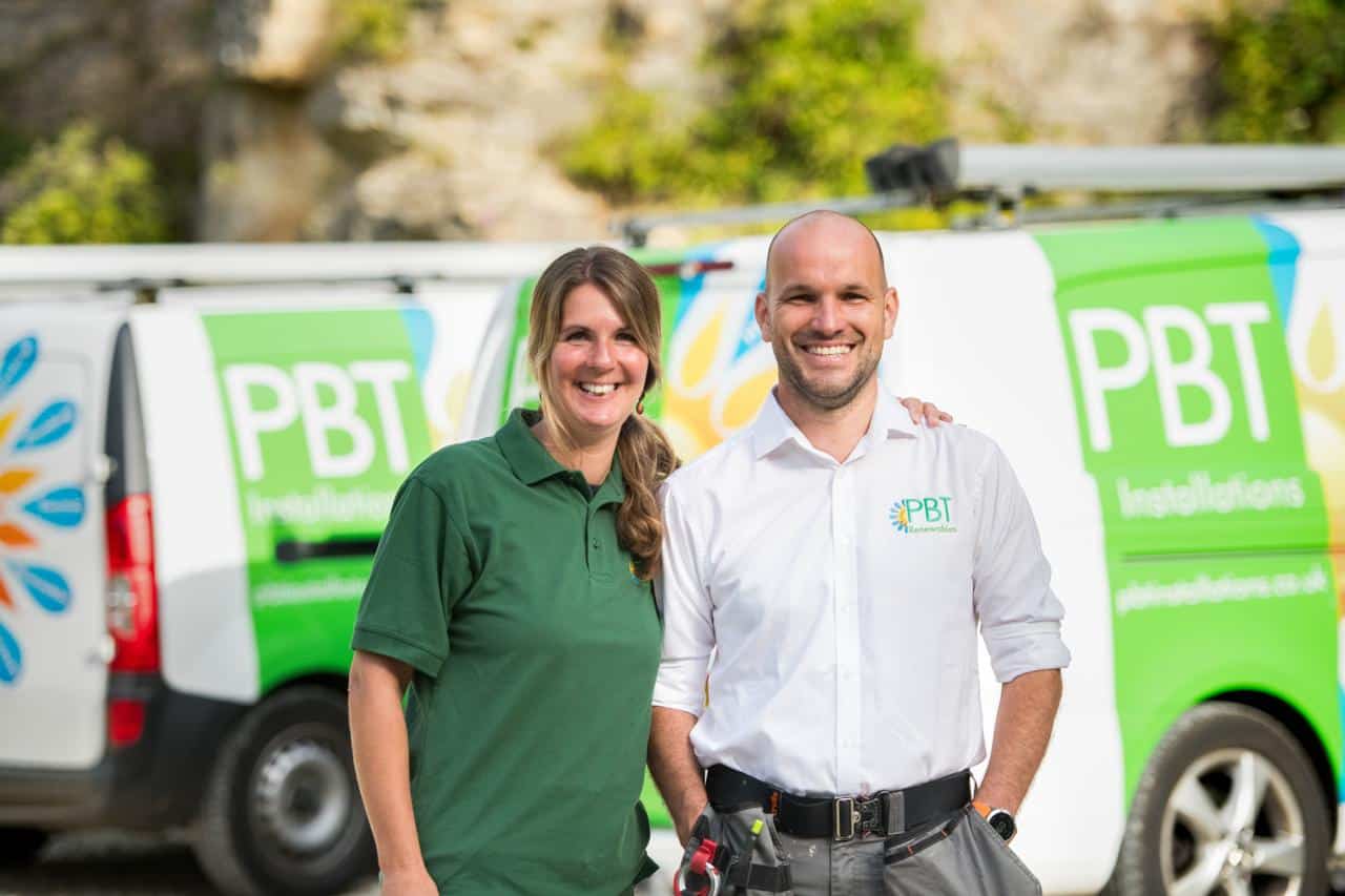 Pete and Laura from PBT Installations with the company vans