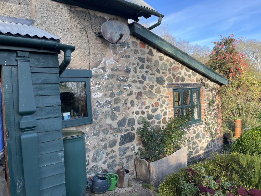 Stone cottage with a grey front door