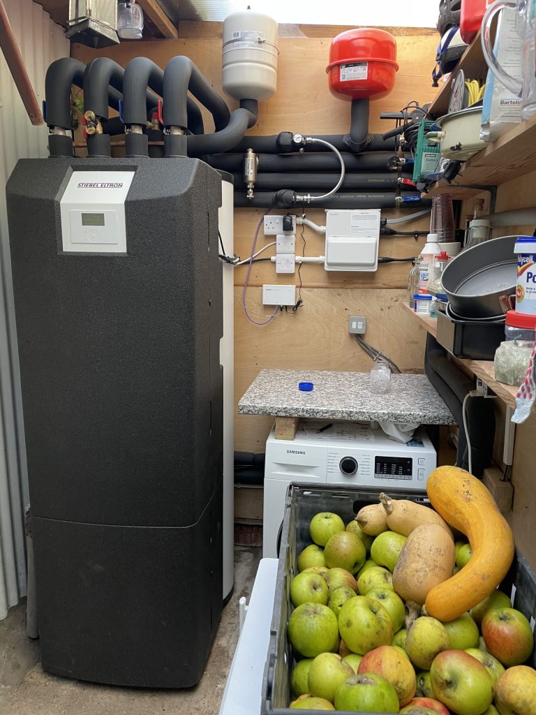 Indoor heat pump cylinder unit in a utility area